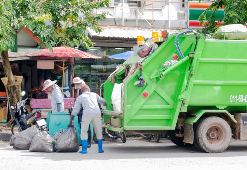 Recycling bins and segregated materials at a Camden clearance